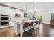 Spacious open-concept kitchen features a large island, stainless steel appliances, and a breakfast nook at 408 Honeybee Ln, Canton, GA 30115