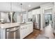 Spacious kitchen with stainless steel appliances, island with seating, and open access to adjacent living spaces at 408 Honeybee Ln, Canton, GA 30115