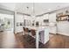 Gourmet kitchen featuring a large island with seating, stainless steel appliances, and white cabinetry at 408 Honeybee Ln, Canton, GA 30115