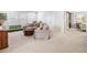 Spacious living room boasts carpeted floors, abundant natural light, and plush seating at 408 Honeybee Ln, Canton, GA 30115