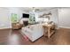 Bright, open living room with hardwood floors, fireplace, and comfortable sectional sofa at 408 Honeybee Ln, Canton, GA 30115