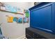 Organized mudroom features a blue bench with storage and art display at 408 Honeybee Ln, Canton, GA 30115