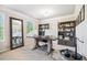 Bright home office with built-in shelving, a large desk, and a full length mirror at 408 Honeybee Ln, Canton, GA 30115