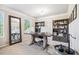 Well-lit home office with built-in bookshelves, large desk and beautiful mirror at 408 Honeybee Ln, Canton, GA 30115