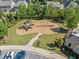 A community playground with new equipment and lush green landscaping in a residential area at 408 Honeybee Ln, Canton, GA 30115