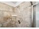Close-up of shower with tiled walls, soap dish, and chrome shower head at 408 Honeybee Ln, Canton, GA 30115