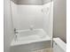 Bathroom with white tiled shower and tub combo at 53 Monet Nw Ct, Atlanta, GA 30327