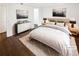 Bright staged bedroom with a large bed and modern decor at 53 Monet Nw Ct, Atlanta, GA 30327