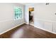 Bright dining room with wood floors and view into the kitchen at 53 Monet Nw Ct, Atlanta, GA 30327