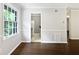 Dining room with wood floors and a large window at 53 Monet Nw Ct, Atlanta, GA 30327