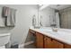 Bathroom featuring a vanity with drawer storage and shower/tub combo at 135 N North River Dr, Atlanta, GA 30350