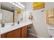 Bright bathroom featuring a shower/tub combo and vanity with storage at 135 N North River Dr, Atlanta, GA 30350