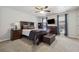 Well-furnished Primary bedroom with dresser, TV, and window with natural light at 135 N North River Dr, Atlanta, GA 30350