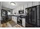 Contemporary kitchen with stainless steel appliances, modern cabinets, and stone countertops at 135 N North River Dr, Atlanta, GA 30350