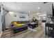 Spacious living room featuring modern furniture and decor in neutral colors at 135 N North River Dr, Atlanta, GA 30350