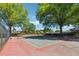 Well-maintained community tennis courts with mature trees offering shade at 135 N North River Dr, Atlanta, GA 30350