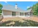 Green backyard with patio at 229 Brookview Pl, Woodstock, GA 30188