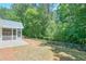 Green backyard with patio at 229 Brookview Pl, Woodstock, GA 30188