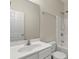 Bathroom with a modern vanity, large mirror, and shower-tub combo at 229 Brookview Pl, Woodstock, GA 30188