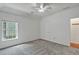 Bedroom featuring neutral carpet, a closet, and large window at 229 Brookview Pl, Woodstock, GA 30188