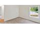 Bedroom with neutral carpet, a double-hung window and direct access to hallway at 229 Brookview Pl, Woodstock, GA 30188