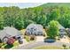 Inviting two-story home featuring a manicured front yard and a two-car garage at 229 Brookview Pl, Woodstock, GA 30188