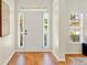 Bright foyer with hardwood floors, white door and sidelight windows at 229 Brookview Pl, Woodstock, GA 30188