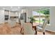 Well-lit kitchen with stainless appliances, center island and an eat-in kitchen area with lots of light and a view at 229 Brookview Pl, Woodstock, GA 30188