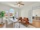 Office with natural light, stylish decor, and an open doorway to dining room at 229 Brookview Pl, Woodstock, GA 30188
