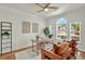 Comfortable office with natural light, stylish decor, and hardwood floors at 229 Brookview Pl, Woodstock, GA 30188