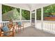 Screened porch with furniture at 229 Brookview Pl, Woodstock, GA 30188