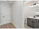 Modern half-bathroom featuring grey vanity, white countertops, and stylish fixtures at 2723 Byess Ct, Marietta, GA 30064