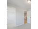 Secondary bedroom featuring a carpet floor, closet, and an open door to an upstairs hallway at 2723 Byess Ct, Marietta, GA 30064