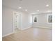 Spacious bonus room filled with natural light, featuring neutral walls and durable wood floors at 2723 Byess Ct, Marietta, GA 30064