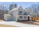 Beautiful home exterior with large garage, concrete driveway, complemented by professionally landscaped yard at 2723 Byess Ct, Marietta, GA 30064