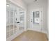 Entryway showcasing elegant French doors, leading to a home with wood floors and natural light at 2723 Byess Ct, Marietta, GA 30064