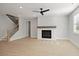 Bright living room featuring a fireplace, hardwood floors, a ceiling fan, and a staircase at 2723 Byess Ct, Marietta, GA 30064