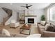 Comfortable living room with a fireplace, ceiling fan, neutral paint, and plush sofas at 2723 Byess Ct, Marietta, GA 30064