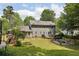Spacious back yard with deck, patio, fire pit and playset on lush and green property at 4261 Vineyard Trl, Snellville, GA 30039