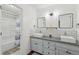 Stylish bathroom with double sinks, granite countertop, subway tile, shower, and bathtub at 4261 Vineyard Trl, Snellville, GA 30039