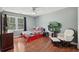 Comfortable bedroom with wood floors, nice window view, and reading corner at 4261 Vineyard Trl, Snellville, GA 30039