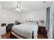 Bedroom with wooden floors, ceiling fan, study desk, and nice window view at 4261 Vineyard Trl, Snellville, GA 30039