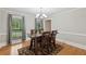 Dining room featuring a wooden table, chair set, and hardwood floors at 4261 Vineyard Trl, Snellville, GA 30039