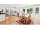 Eat-in kitchen features a bay window, dining table, and stainless steel appliances at 4261 Vineyard Trl, Snellville, GA 30039