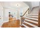 Bright foyer with hardwood floors, staircase, and view of living room at 4261 Vineyard Trl, Snellville, GA 30039