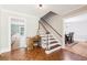 Foyer with staircase and view into the living room and dining room at 4261 Vineyard Trl, Snellville, GA 30039