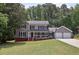 Charming two-story home with gray siding, black shutters, and a well-manicured front lawn at 4261 Vineyard Trl, Snellville, GA 30039