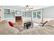 Bright living room with hardwood floors, built-in bookshelves, and a cozy brick fireplace at 4261 Vineyard Trl, Snellville, GA 30039