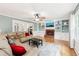 Bright living room with hardwood floors, built-in bookshelves, and a cozy brick fireplace at 4261 Vineyard Trl, Snellville, GA 30039