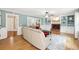 Bright living room with hardwood floors, built-in bookshelves, and a comfortable sectional sofa at 4261 Vineyard Trl, Snellville, GA 30039